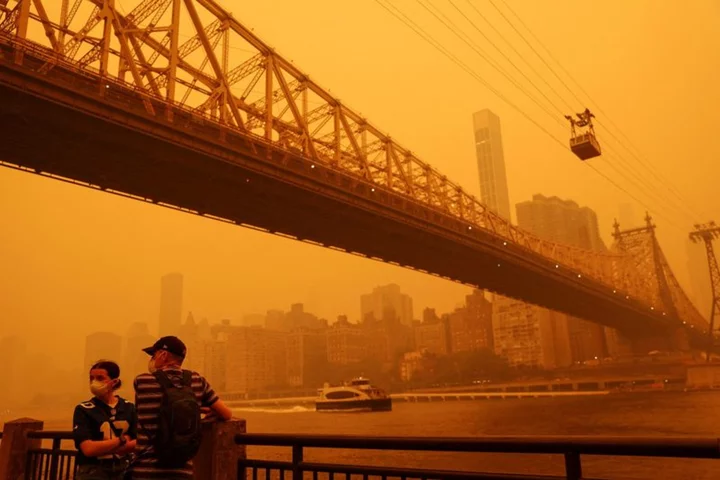 U.S. East Coast blanketed in eerie veil of smoke from Canada fires